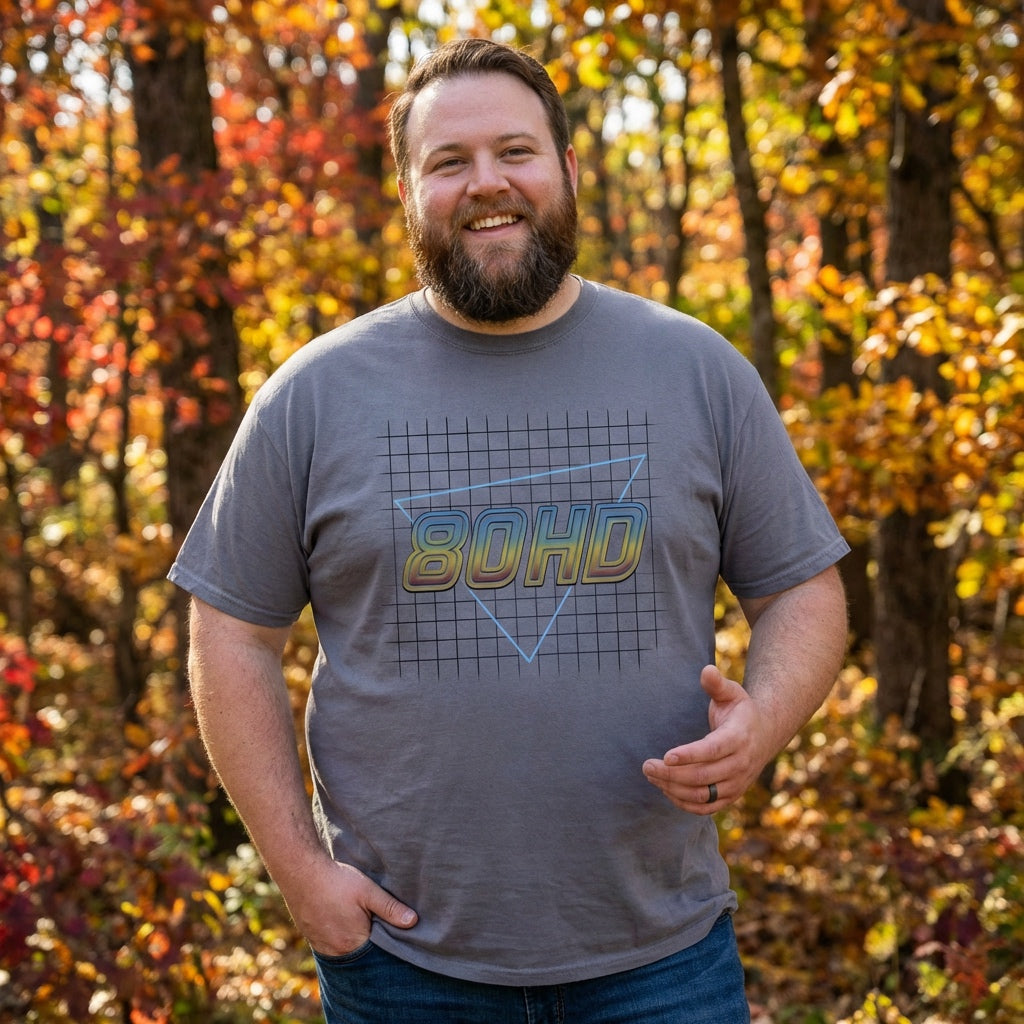 Man wearing a gray t-shirt with '8OHD' logo in an autumn forest